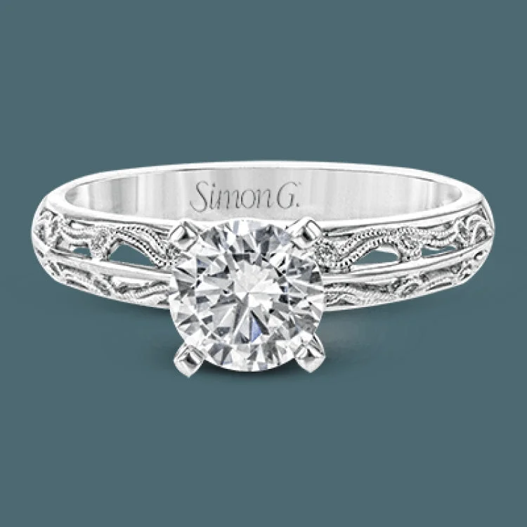 Women’s fine diamond engagement rings-A whimsical openwork design glimmers with .04 ctw of round white diamonds in this charmingly beautiful white gold engagement ring.