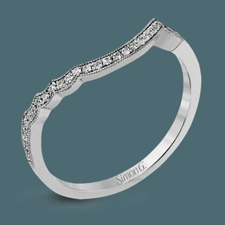 Women’s vintage-inspired engagement rings-This lovely modern white gold engagement ring features a memorable halo and is accentuated by .19 ctw glistening round cut white diamonds.