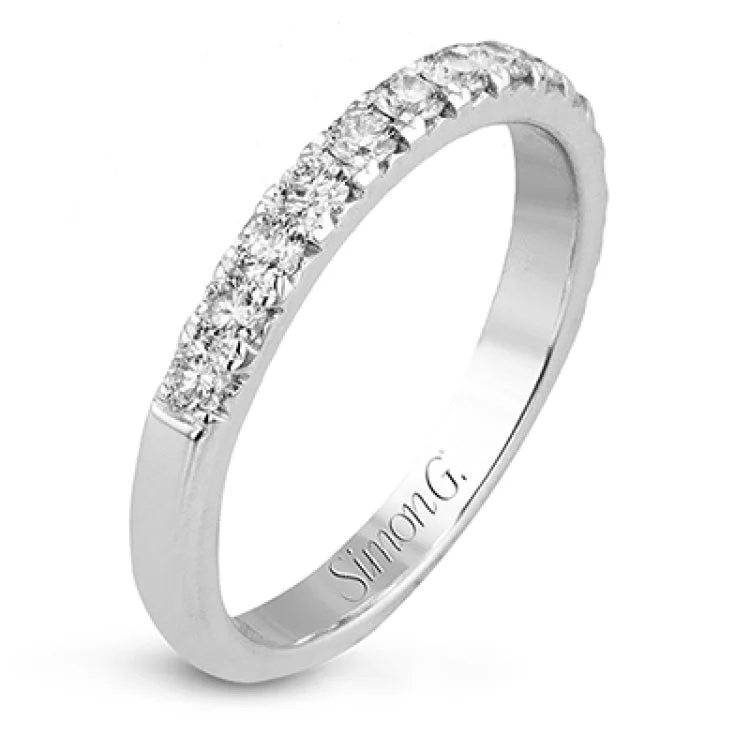 Women’s personalized diamond engagement rings-This beautiful white gold engagement ring is set with .55 ctw of round white diamonds flanking the center stone, as well as a distinctive rose gold accent