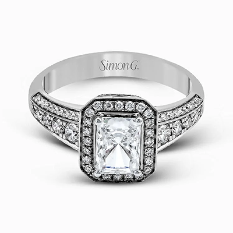 Women’s antique diamond engagement rings-This romantic white gold engagement ring is complemented by .57 ctw of sparkling round cut white diamonds in a vintage-inspired setting.