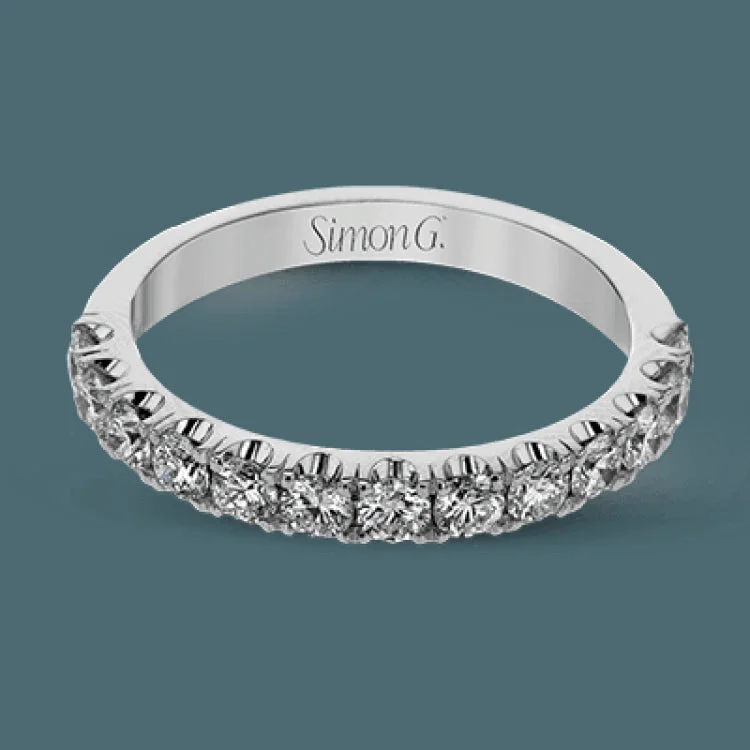 Women’s three-stone engagement rings-This wedding band has a beautiful timeless design which will be in style for years. The ring contains .77 ctw of white diamonds.