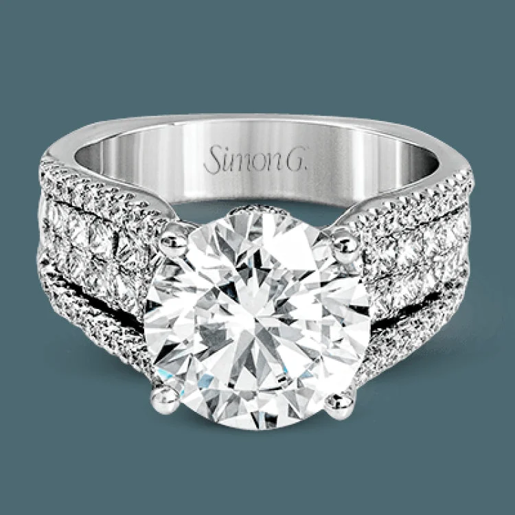 Women’s wedding and engagement rings-This bold 18k white gold engagement setting contains 1.04 ctw of princess cut diamonds alongside .40 ctw of round brilliant diamonds.