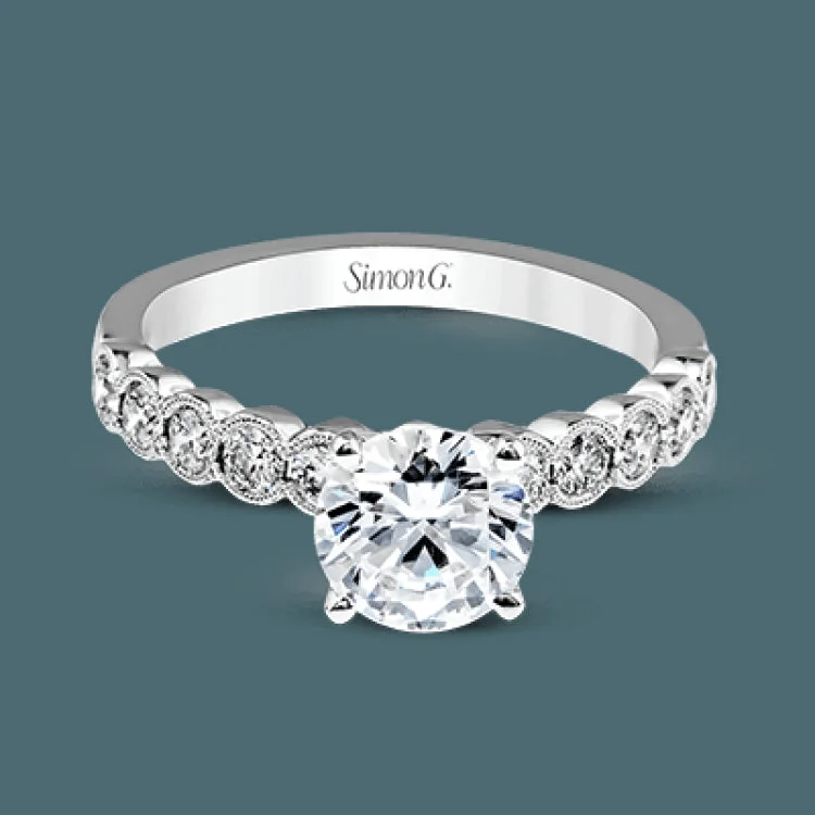 Women’s romantic engagement rings-This engagement and wedding band set combines old and new with 1.09 ctw of round brilliant diamonds bezel set into 18k white gold, accented with vintage-inspired milgrain.