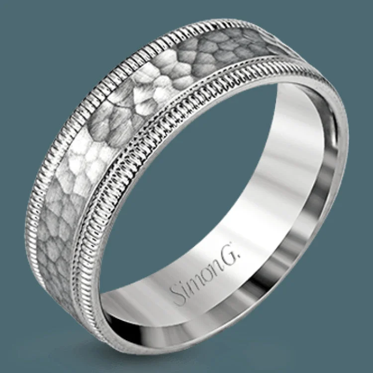 Women’s solitaire engagement rings-This stunning contemporary platinum men's wedding band features a hammered center column outlined dual milgrain edges for an eye-catching design.