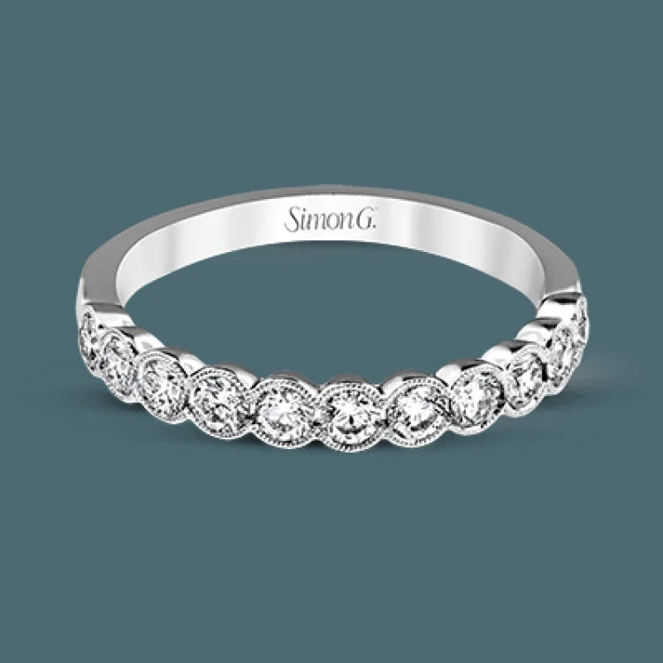 Women’s silver engagement rings with diamonds-This engagement and wedding band set combines old and new with 1.09 ctw of round brilliant diamonds bezel set into 18k white gold, accented with vintage-inspired milgrain.