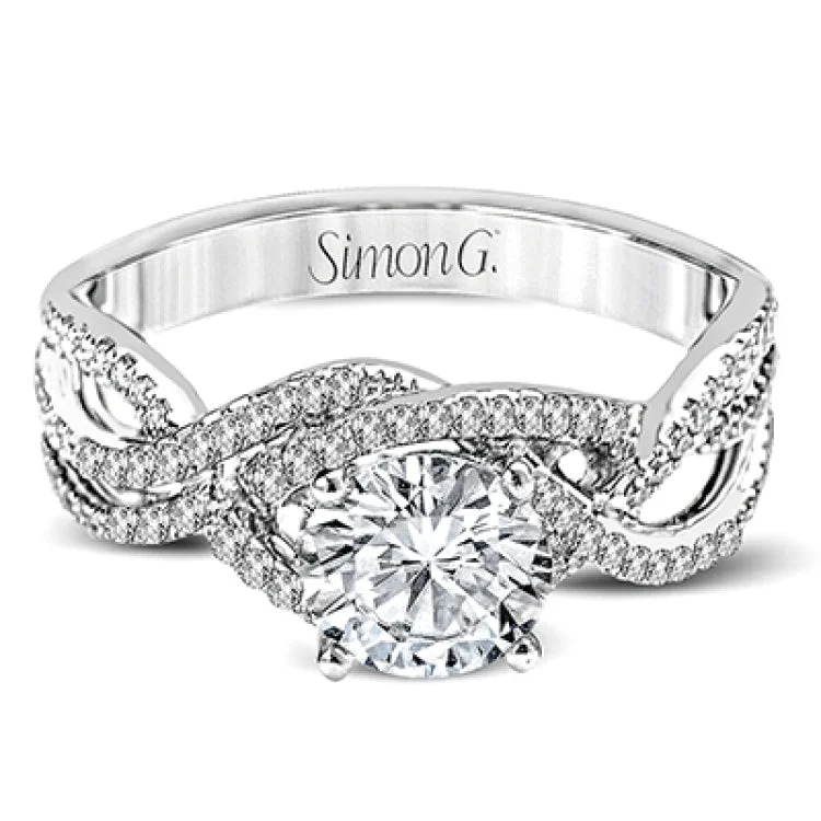 Women’s platinum solitaire engagement rings-This lovely modern white gold engagement ring features an intricate twisted shank design set with .29 ctw of round cut white diamonds.