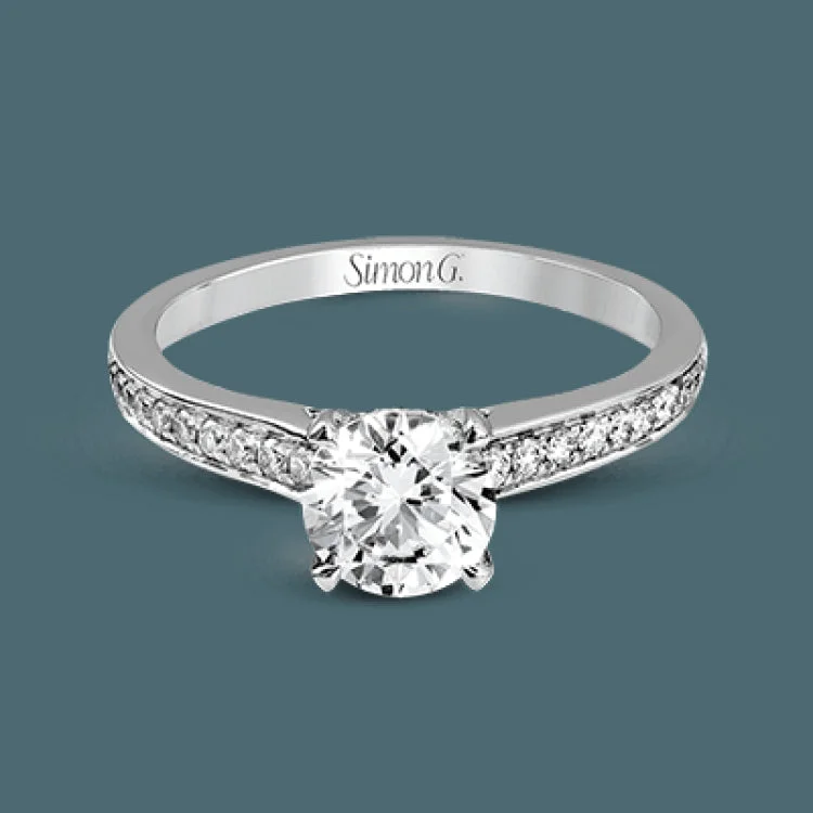 Women’s vintage diamond solitaire engagement rings-An exquisite statement, this engagement ring features .23 ctw of white diamonds in 18k white gold through the center, bordered by .25 ctw on pink diamonds set into 18k rose gold.