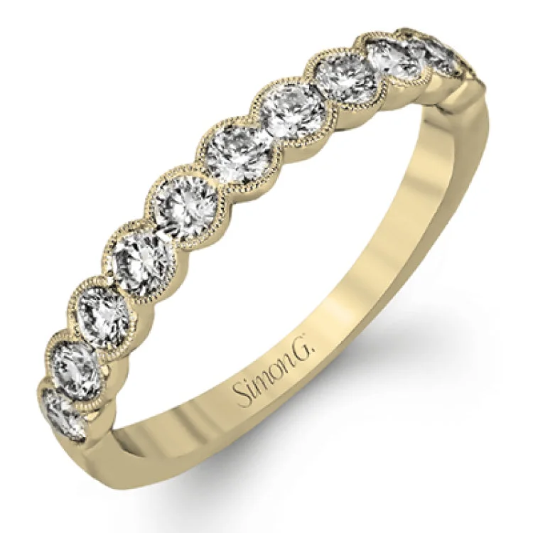 Women’s champagne diamond engagement rings-This engagement and wedding band set combines old and new with 1.09 ctw of round brilliant diamonds bezel set into 18k white gold, accented with vintage-inspired milgrain.