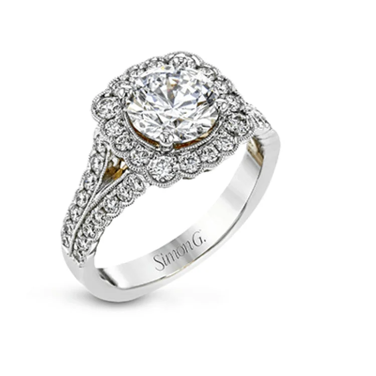 Women’s pear-cut solitaire engagement rings-This engagement ring has a unique design with a halo of bezel set diamonds. The setting contains .81 ctw of white diamonds.