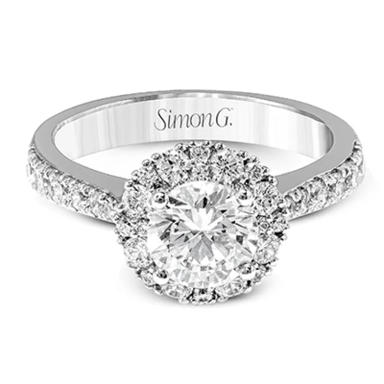 Women’s platinum engagement rings-This gorgeous white gold engagement ring's clean yet romantic design features .60 ctw of round white diamond accents.