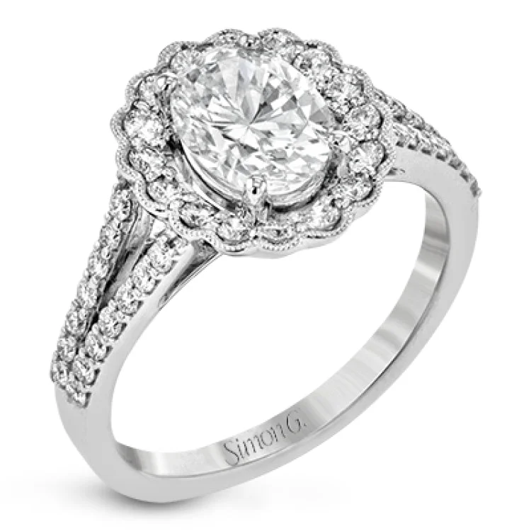 Women’s platinum engagement rings with diamonds-This delightful engagement ring features a scalloped halo that surrounds the center stone like a flower, containing .52 ctw of white diamonds.