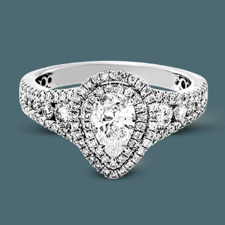 Women’s elegant engagement rings-Featuring a pear-shaped double halo, this modern white gold engagement ring is highlighted by .68 ctw of round cut white diamonds.