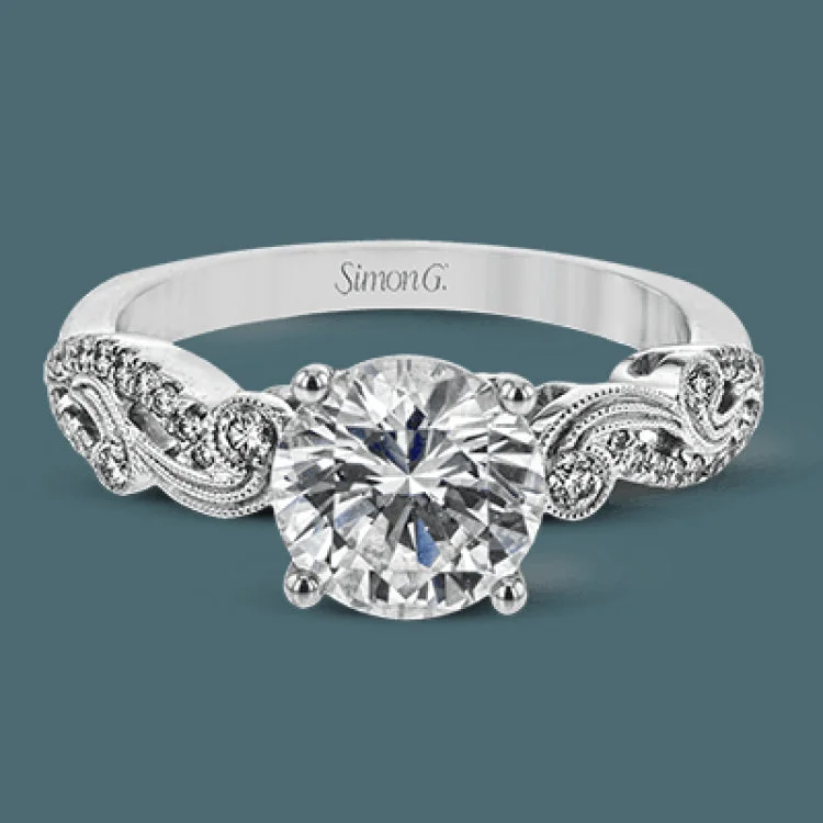 Women’s silver engagement rings with diamonds-The swirling, organic design of this white gold engagement ring features .19 ctw of round white diamonds for added charm.