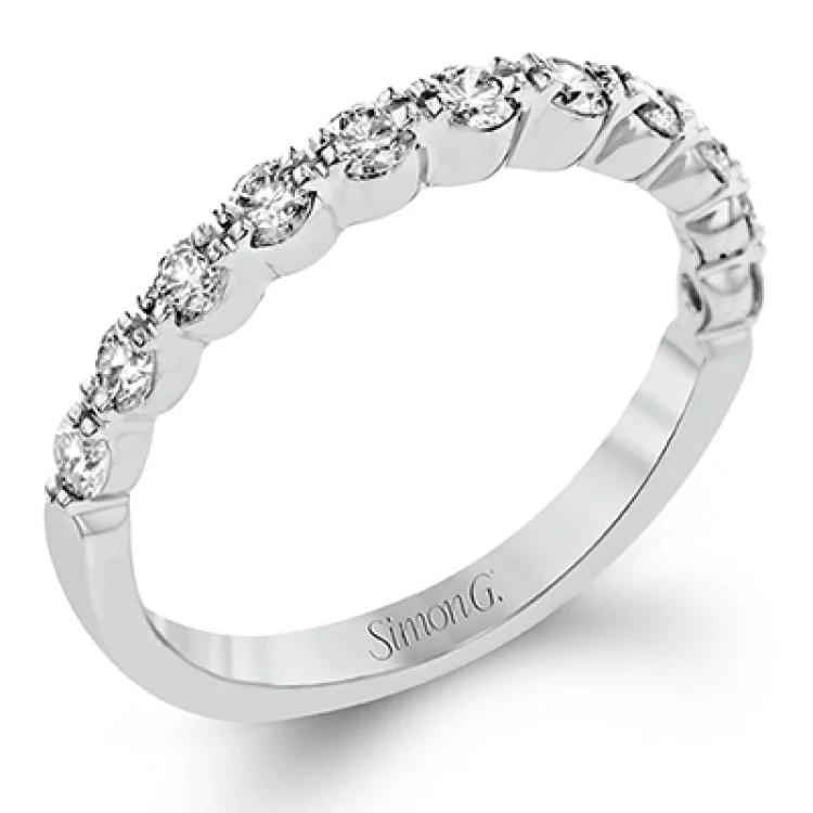 Women’s solitaire engagement rings-The delicate design of this classic white gold engagement ring features a sparkling pave halo accented with .86 ctw of shimmering round cut white diamonds.