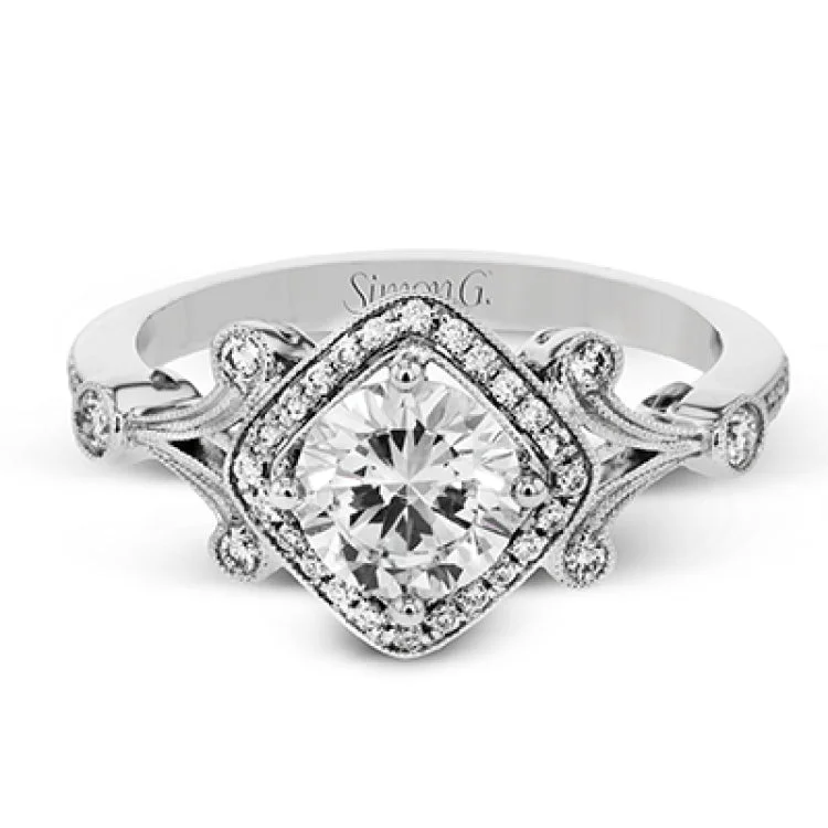 Women’s minimalist engagement rings-This beautiful vintage-inspired engagement ring makes a unique statement with .20 ctw of white diamonds.