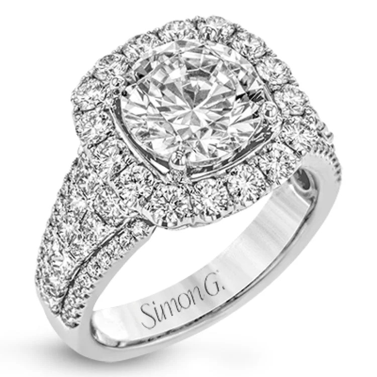 Women’s platinum halo engagement rings-This engagement ring is set to stun with an astonishing 1.07 ctw of princess cut diamonds alongside .99 ctw of round diamonds creating a statement effect.