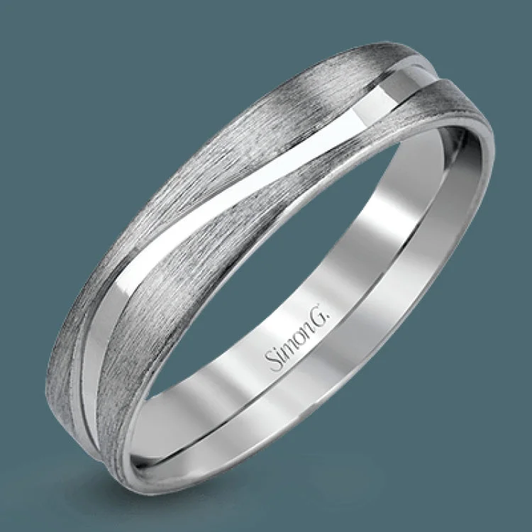 Women’s elegant engagement rings-This completely modern men's wedding band boasts a matte white gold design with a contrasting ribbon of polished white gold winding its way around this eye-catching band.