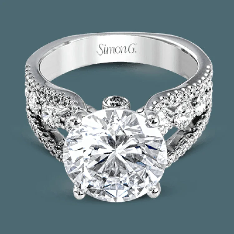 Women’s diamond wedding engagement rings-This amazing 18k white gold engagement ring contains 1.66 ctw of white round brilliant diamonds in a modern yet classic design.