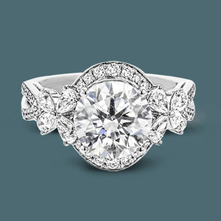 Women’s eco-friendly engagement rings-Dramatic yet romantic, this exquisite white gold engagement ring features .61 ctw of round cut white diamonds highlighted by .58 ctw of pear shaped diamonds in delicate floral motifs.