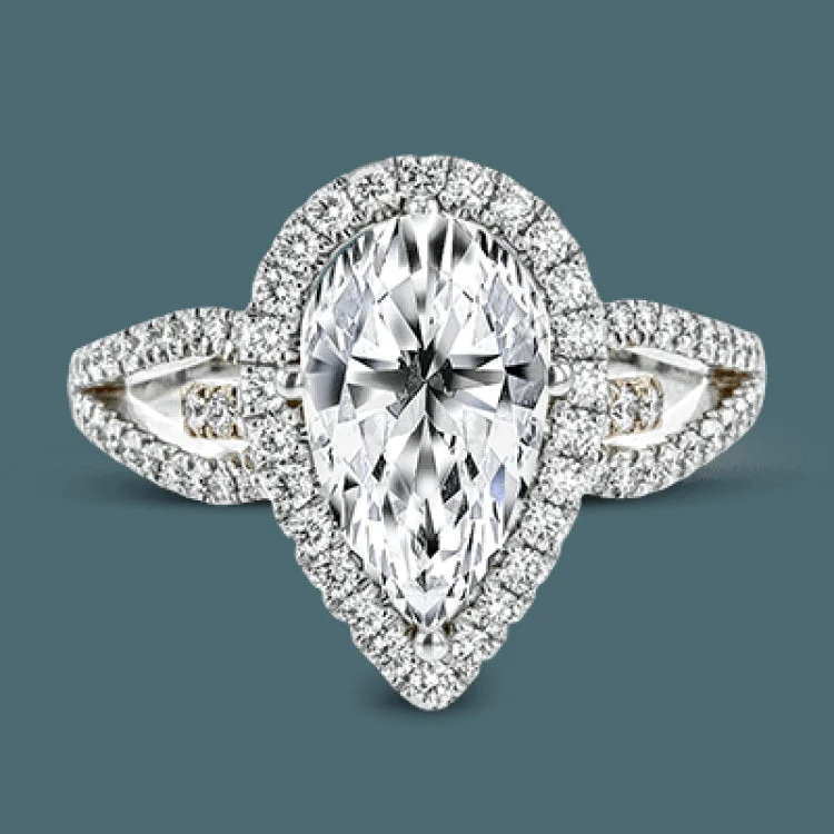 Women’s champagne diamond engagement rings-Featuring a lovely pear-shaped halo, this contemporary white and rose gold engagement setting is complemented by a split shank design containing .45 ctw round cut white diamonds and .08 ctw pink diamonds.