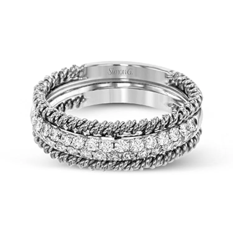 Women’s luxury halo engagement rings-This unique white gold wedding band features .49 ctw of round white diamonds as well as a distinctive edging of coiled rose gold