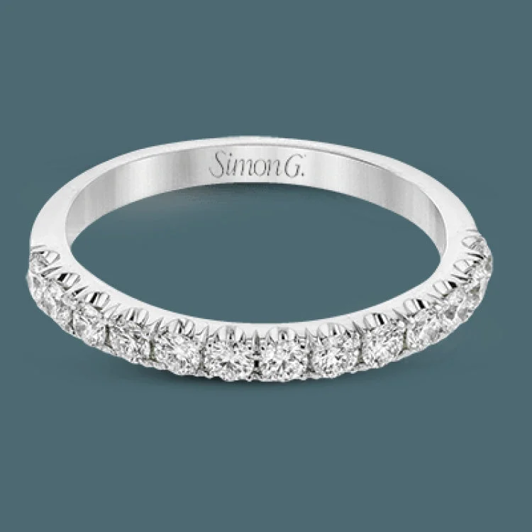 Women’s diamond wedding engagement rings-This classic wedding band features a distinctive setting style that shows off the .50 ctw of white diamonds to their full advantage.