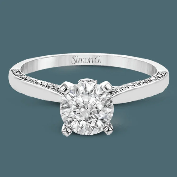 Women’s bridal engagement rings-This absolutely stunning white gold engagement ring features a sleek design with .21 ctw of round white diamonds for a touch of glamour.