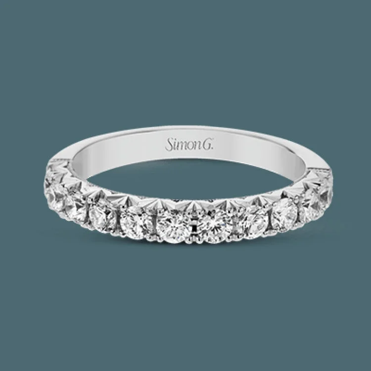 Women’s antique engagement rings-This classic wedding band features a distinctive setting style that shows off the .75 ctw of white diamonds to their full advantage.