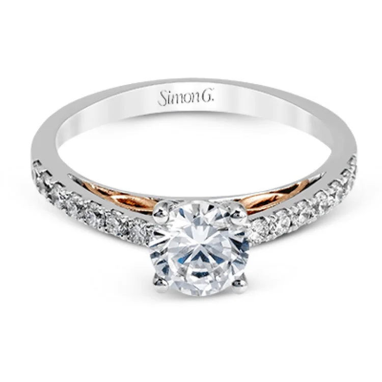 Women’s cushion halo engagement rings-This classically designed 18k white gold wedding set is highlighted by rose gold accents and .45 ctw of round white diamonds.