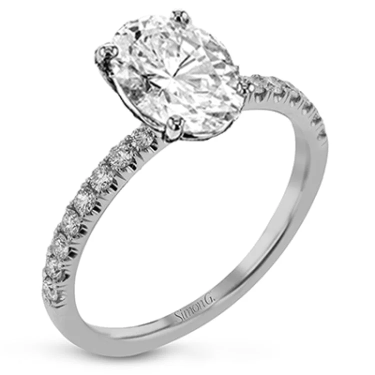 Women’s three-stone diamond engagement rings-This distinctive bridal set design features a double-layer wedding band that fits around the engagement ring. The set contains .77 ctw of white diamonds.