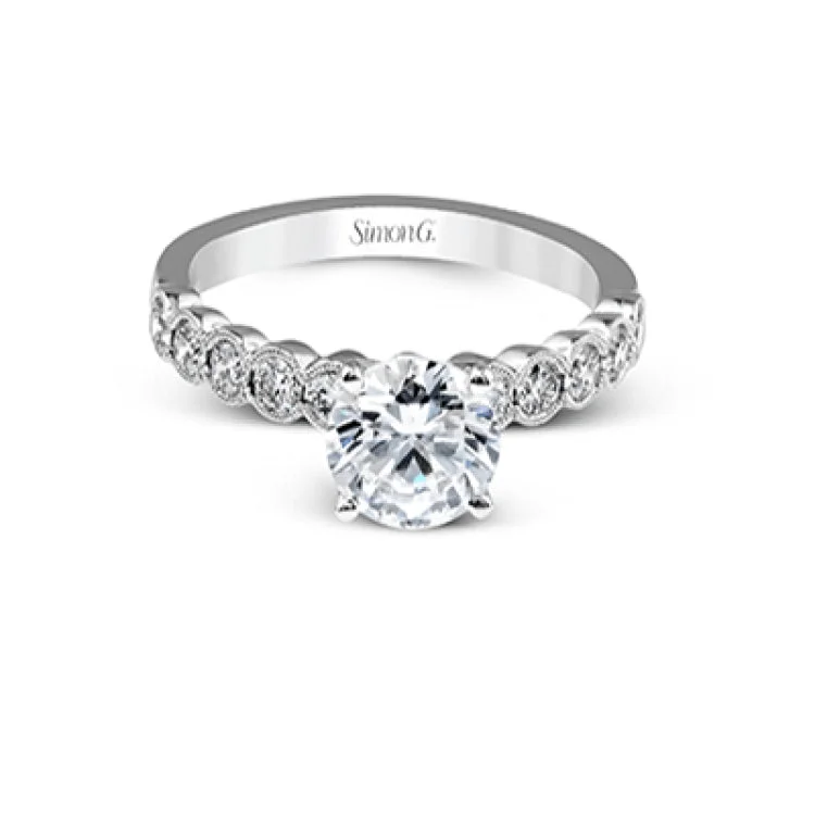 Women’s stackable engagement rings-This engagement and wedding band set combines old and new with 1.09 ctw of round brilliant diamonds bezel set into 18k white gold, accented with vintage-inspired milgrain.