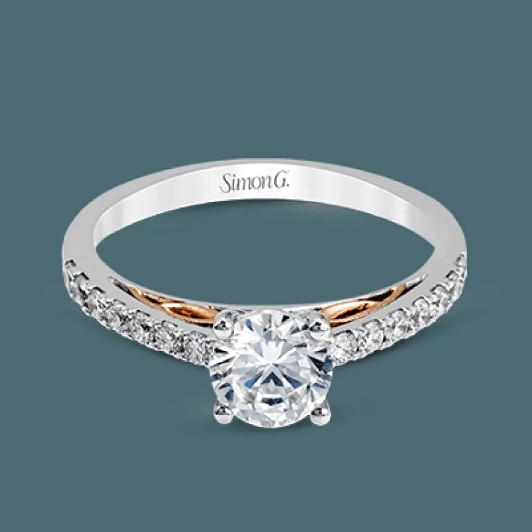 Women’s silver engagement rings-This classically designed 18k white gold wedding set is highlighted by rose gold accents and .45 ctw of round white diamonds.