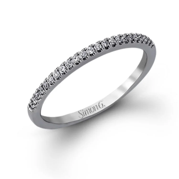 Women’s white diamond engagement rings-Featuring a distinctively romantic design, this white gold engagement ring and band are set with .22 ctw of round cut white diamonds, .09 ctw of marquise cut diamonds, and .13 ctw pear-shaped diamonds.