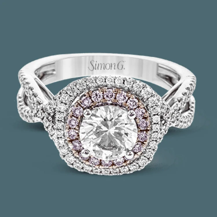 Women’s pear cut engagement rings-This lovely halo engagement ring is crafted in tones of 18k rose and white gold and contains .36 ctw of white diamonds along with .18 ctw of pink diamonds.