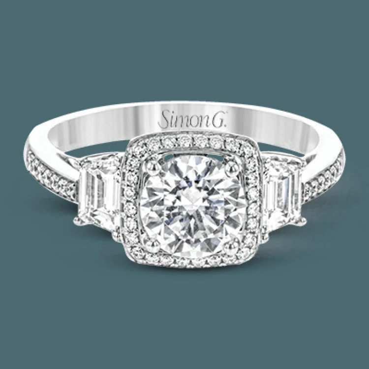 Women’s platinum engagement rings with diamonds-This splendid, distinctive white gold engagement ring features filigree accents and .17 ctw of round white diamonds and .51 ctw of trapezoid shaped white diamonds hugging the center stone.