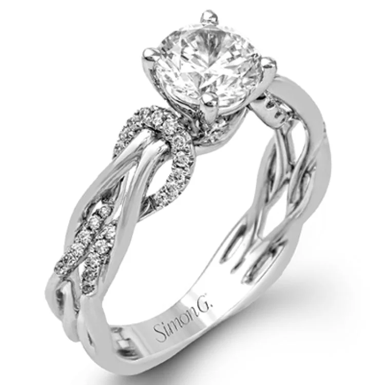 Women’s vintage-inspired engagement rings-This impressive contemporary two-tone engagement ring features a unique twisting design on the shank, which is complemented by .17 ctw of round cut white diamonds.