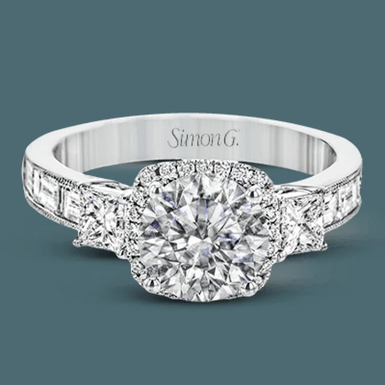 Women’s unique diamond engagement rings-The impressive circular halo of this white gold engagement ring is set with .10 ctw round cut white diamonds and emphasized by .43 ctw princess cut diamonds and .58 baguette cut diamonds.