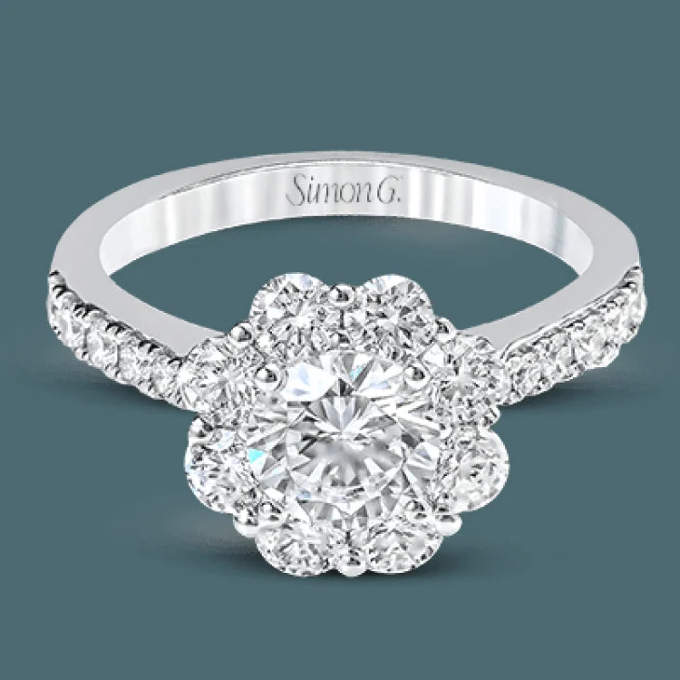 Women’s halo engagement rings with diamonds-This playful white gold wedding set features .92 ctw of round white diamonds and an exaggerated halo for a subtle floral-inspired design.