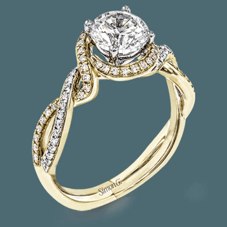 Women’s princess-cut engagement rings-This twisting, two-tone 18k white and yellow gold engagement ring is set with .24 ctw of white round brilliant diamonds.