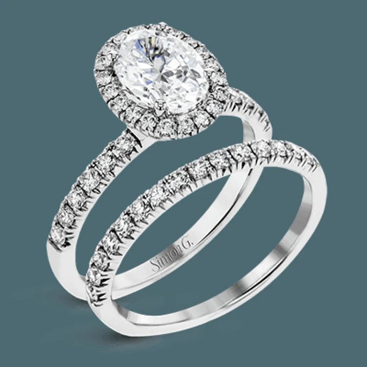 Women’s pear-cut solitaire engagement rings-This is a classic halo design wedding set made for an oval center stone contains .72 ctw of white diamonds.