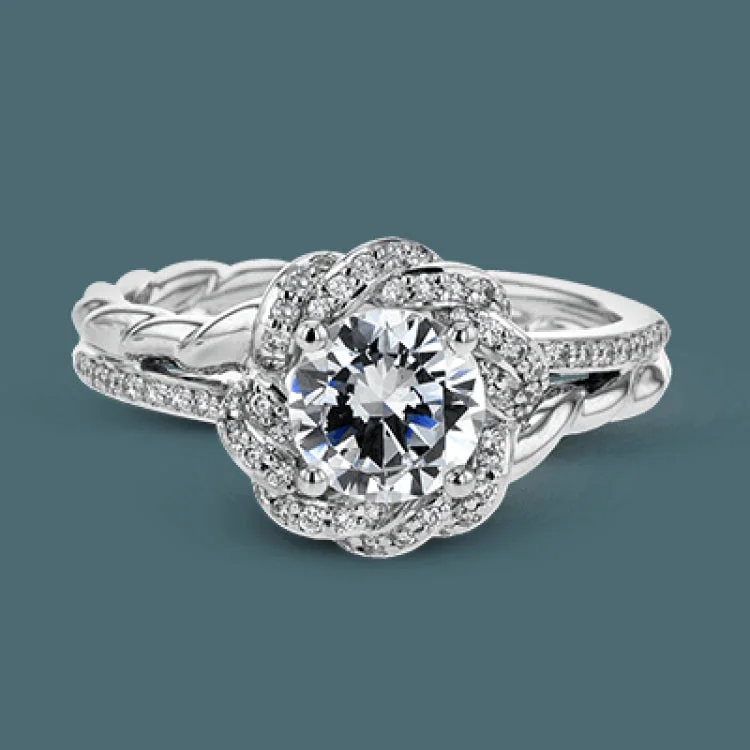 Women’s princess-cut engagement rings-This contemporary engagement ring design features a modern twist design with a halo containing .19 ctw of white diamonds.