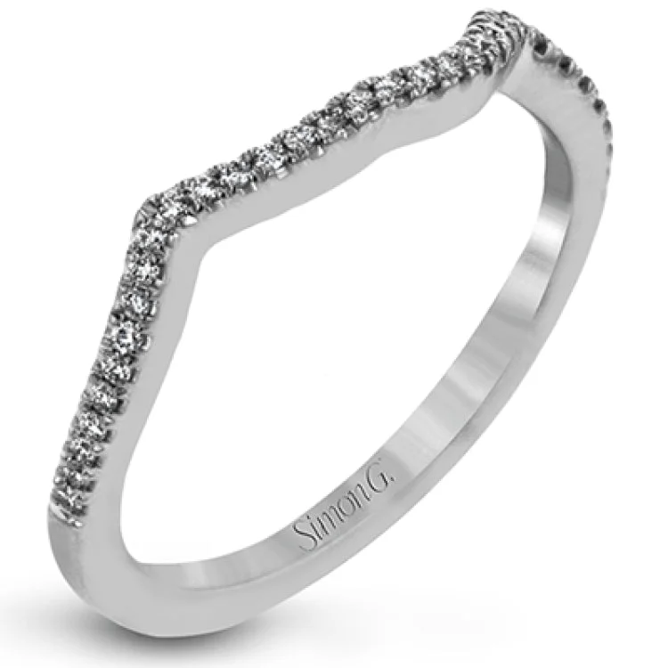 Women’s luxury engagement rings-This lovely modern white gold engagement ring features an intricate twisted shank design set with .29 ctw of round cut white diamonds.