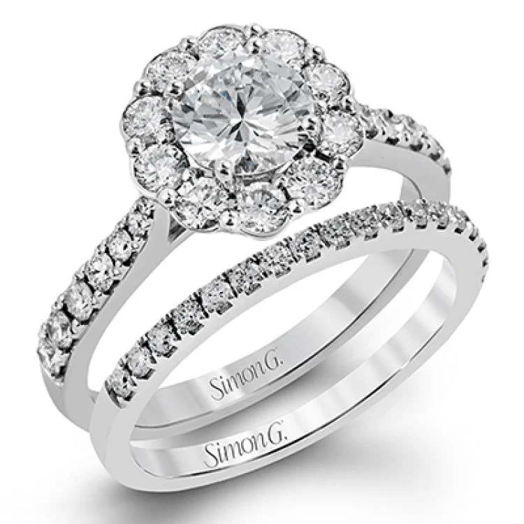 Women’s sapphire engagement rings with diamonds-This playful white gold wedding set features .92 ctw of round white diamonds and an exaggerated halo for a subtle floral-inspired design.