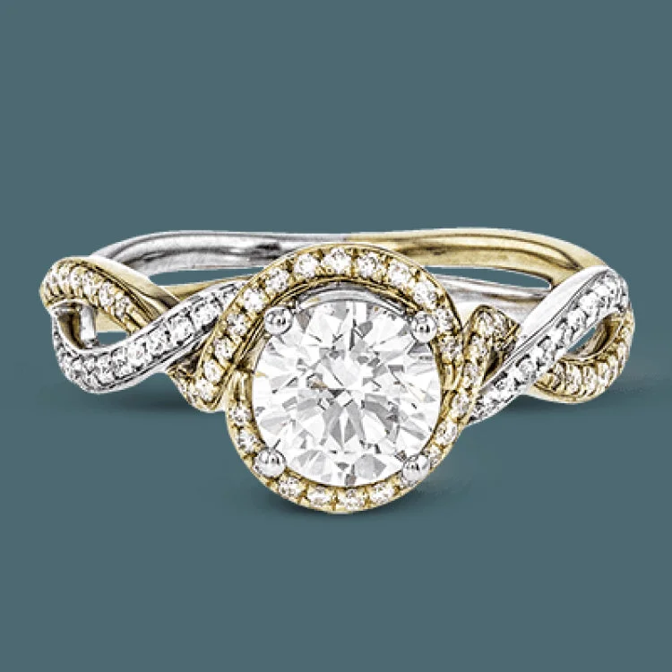 Women’s emerald solitaire engagement rings-This twisting, two-tone 18k white and yellow gold engagement ring is set with .24 ctw of white round brilliant diamonds.