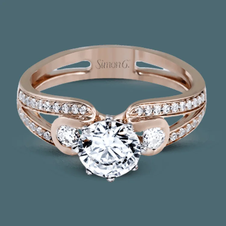 Women’s radiant cut engagement rings-This classic rose gold engagement ring and wedding band set is accentuated by .16 ctw of round cut white diamonds complemented with .14 ctw side stones.