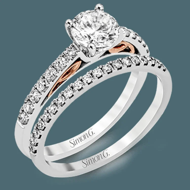 Women’s minimalist engagement rings-This classically designed 18k white gold wedding set is highlighted by rose gold accents and .45 ctw of round white diamonds.