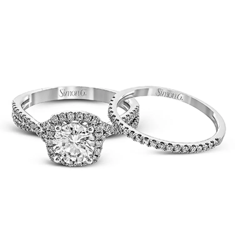 Women’s moissanite engagement rings-Presenting a lovely twisted shank design, this contemporary white gold engagement ring and wedding band set is accentuated with .44 ctw round cut white diamonds.