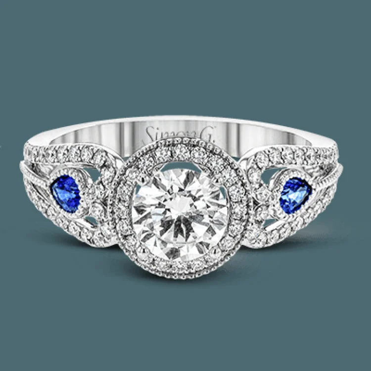 Women’s rose diamond engagement rings-This intricate vintage-inspired engagement ring has two accent sapphire side stone totaling .25 ctw, while .33 ctw of white diamonds sparkle on the rest of the setting.