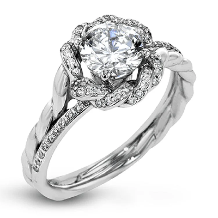 Women’s classic engagement rings-This contemporary engagement ring design features a modern twist design with a halo containing .19 ctw of white diamonds.