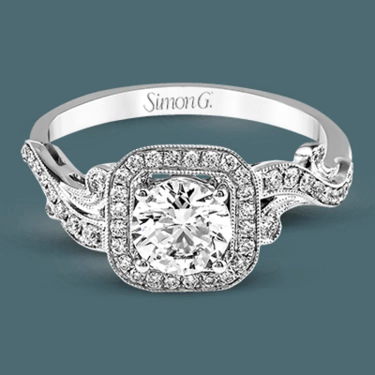 Women’s halo diamond engagement rings-Featuring an elegant design, this white gold classic engagement ring is accented with .25 ctw round cut white diamonds.